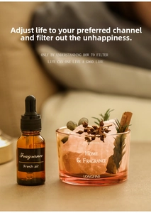 Close-up of aromatherapy crystal stones with cinnamon sticks and essential oil bottle