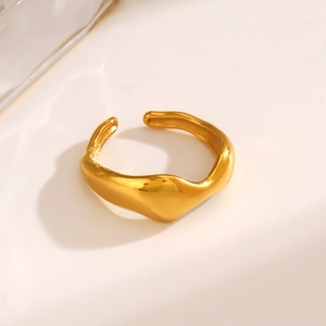 Minimalist irregular wavy open ring in gold stainless steel on a white background
