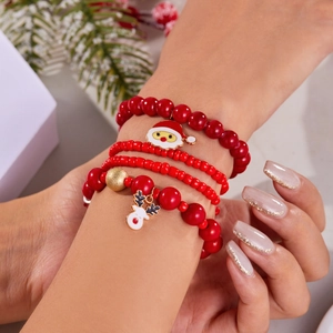 Bracciale natalizio rosso con perline e ciondoli smaltati di Babbo Natale e renna