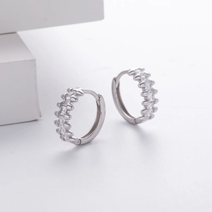 Macro shot of S925 sterling silver hoop earrings with micro-set white zircon details