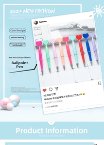 Detail of colorful macaron plastic heart pens with silver accents in a creative layout