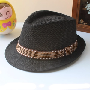 Detail shot of black woven straw fedora hat featuring a striped decorative band for kids