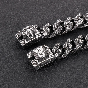 Macro detail of punk tiger head clasp and textured link chain on retro silver steel bracelet