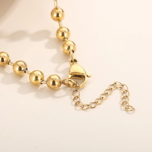 Parure de bijoux cœur dorée avec fermoir mousqueton et chaîne d'extension réglable