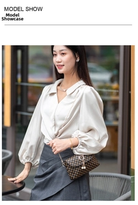Brown checkered chain mini bag with pearl charm shown on a stylish model outfit