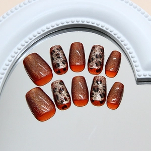 Handmade leopard cat-eye press-on nails with amber glitter and caramel tones