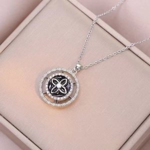 Silver rotating sunflower pendant necklace with white zircons in a premium jewelry box
