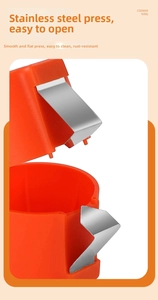 Macro shot of durable orange egg cracker tool with stainless steel pressing piece