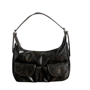 Retro black baguette shoulder bag with textured leather and front pockets on white background