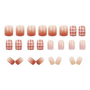 Short square press-on nails with orange gradient, red plaid design and shimmer finish