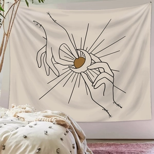Bohemian minimalist wall tapestry featuring sun and moon line art in a cozy bedroom setting