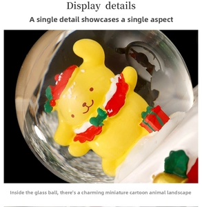 Macro display of a yellow cartoon character inside a clear Christmas snow globe