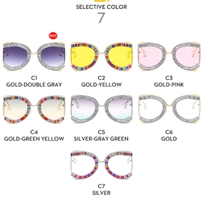 Detailed row of butterfly crystal sunglasses in gold and silver luxury frames