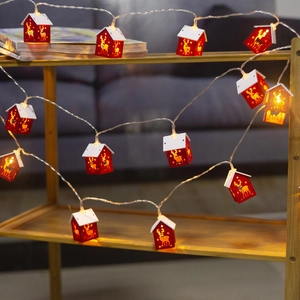 Festive LED wooden house string lights with reindeer and star cutouts for Christmas decor