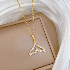 Luxe gold-plated titanium steel necklace featuring a hollow zircon-set fishtail pendant