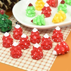 Detailed close-up of colorful resin Christmas tree charms for DIY crafts and decor