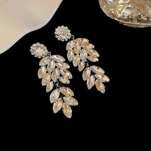 Silver drop earrings featuring marquise zircon leaf tassels on a black background