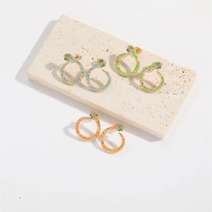 Three pairs of vintage gold snake hoop earrings with colorful enamel and green zircon eyes