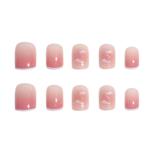 Pink blush ombre press-on nails with white cloud patterns and silver glitter accents