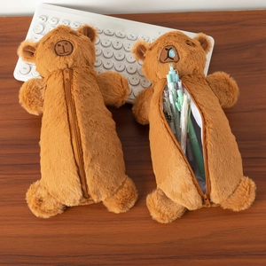 Cute brown plush Capybara pencil case shown open and closed with pens on office desk