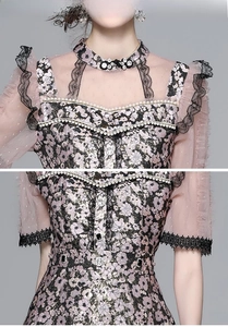 Detail of floral lace dress showing pearl-beaded collar and sheer mesh拼接 texture