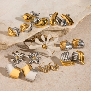 Two-tone gold and silver irregular stainless steel jewelry set on natural stone background
