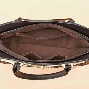 Spacious black hollow-out tote bag interior with multiple organizational pockets