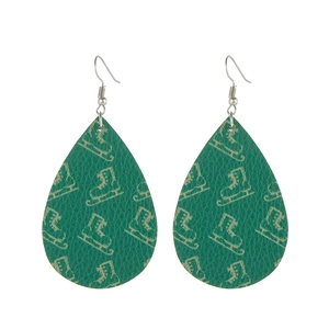 Detail of emerald faux leather teardrop earrings with gold ice skate patterns