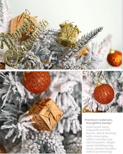 Detail of frosted mini Christmas tree with red gold ornaments and solid wood base