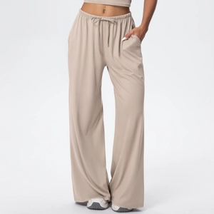 Detail of high waist drawstring on light khaki wide-leg yoga pants with soft fabric