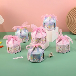 European octagonal carousel candy box with unicorn motifs and pink organza ribbon