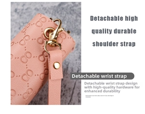 Detail of pink embossed leather wallet with golden clasp and detachable wrist strap