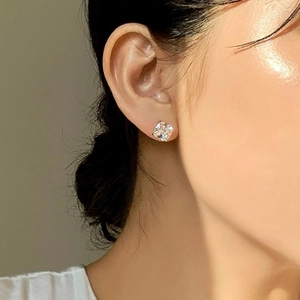 Elegant 925 sterling silver stud earrings with square-cut cubic zirconia on model ear