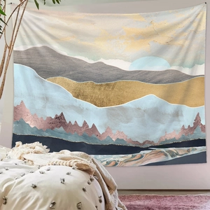 Detailed view of an abstract mountain tapestry with gold lines in a cozy bedroom setting