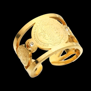 Detailed macro view of the gold-plated St. Benedict medal ring with cubic zirconia stones