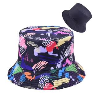 Reversible bucket hat with colorful graffiti print and solid black lining