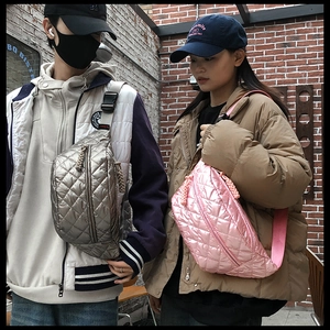 Close-up of quilted winter crossbody bags in metallic silver and pink color options