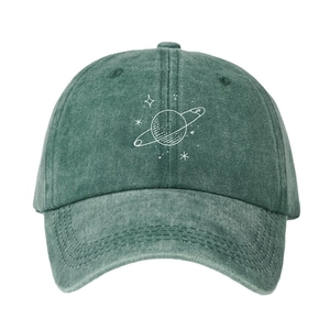 Vintage washed green cotton baseball cap with white planet print design on a white background