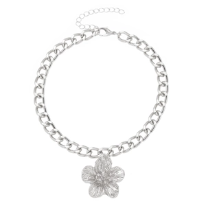 Macro shot of silver textured flower pendant necklace with elegant metal link chain