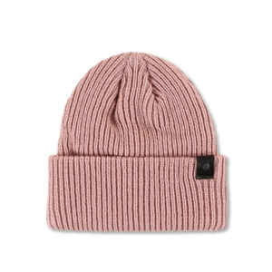 Close-up of thick ribbed knit pink beanie featuring side leather strap and button detail
