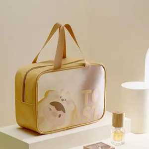 Detail of ginger yellow PU leather bag with Toast Bear print and 30x22x12cm size label