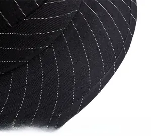 Macro shot of black British jazz hat with white pinstripe texture and curved brim detail