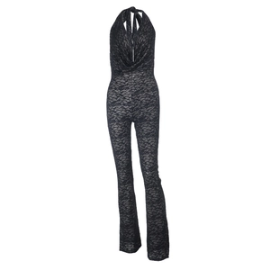 Detail of black crochet lace jumpsuit featuring a halter neck and deep V-neckline