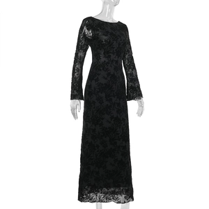 Detail of black long-sleeve dress featuring intricate floral lace and flocking texture