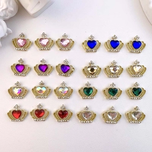 Set of 24 colorful crown heart-shaped nail rhinestones arranged on a textured surface