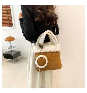 Detail of brown faux suede bucket bag with white faux fur trim and round coin purse