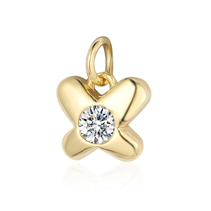 Macro detail of golden butterfly pendant with sparkling round cubic zirconia stone insert