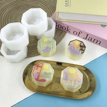 Detail of square silicone mold and finished mooncake soaps with rabbit and moon patterns