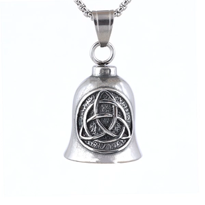 Detail of vintage stainless steel bell pendant featuring a Triquetra Celtic knot design