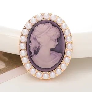 Detail of vintage cameo charm with purple profile and faux pearl border for DIY crafts